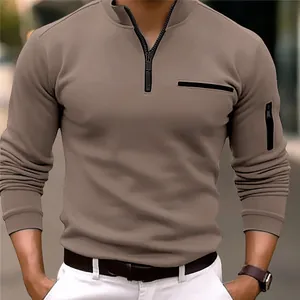 Detail of men's khaki long sleeve polo shirt with arm zipper pocket and stand collar.