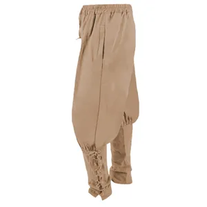 Close-up detail of brown medieval pirate trousers with vintage lace-up ankle design.