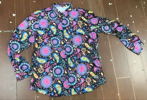 Detailed macro view of a colorful 70s retro disco floral print long sleeve shirt for men