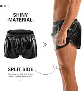 Detail of men's shiny black shorts featuring a split side design and slim fit cut.