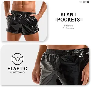 Detail view of men's shiny black shorts showing slant pockets and elastic waistband