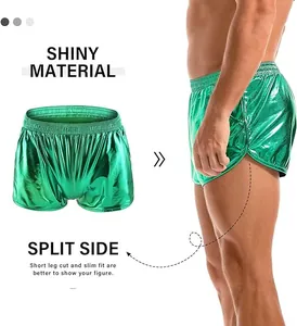 Detailed macro view of men's shiny green metallic shorts featuring split side design