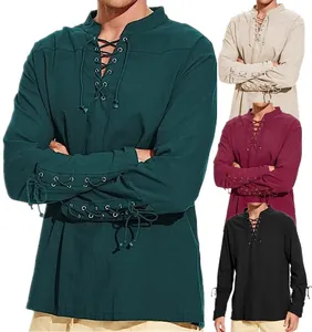 Vintage men's Renaissance lace-up tunic shirt in green, beige, burgundy, and black.