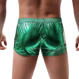 Back view detail showing the texture of metallic green shiny shorts for men with elastic waist