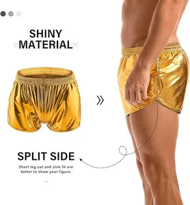 Close-up of gold shiny material and split side detail on men's summer shorts.