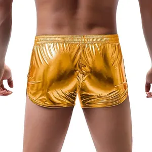 Back view of men's metallic gold shiny shorts with elastic waistband for summer sports