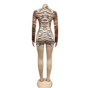 Detailed back view of a sexy long-sleeve tiger print romper bodysuit on mannequin