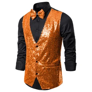 Close-up of vibrant orange sequined vest with matching bow tie for stage performance