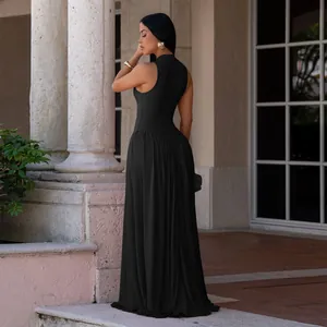 Elegant black sleeveless maxi dress with mock neck, shown in a classic outdoor setting.