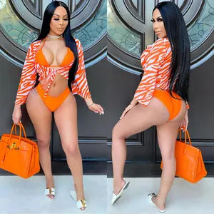 Sexy vibrant orange zebra print three-piece bikini set including mesh cover-up cardigan