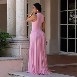 Detailed view of the back and pleated skirt of this elegant pink sleeveless maxi dress.
