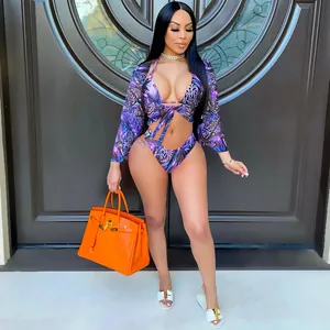Sexy three-piece purple leopard print bikini set featuring a matching long sleeve mesh cover-up