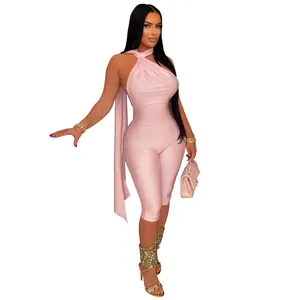 Side view detail of a sexy pink halter neck backless bodycon jumpsuit on model