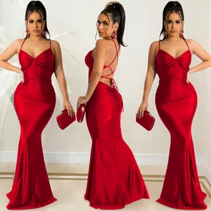 Detailed view of the red backless lace-up evening dress with a mermaid silhouette.
