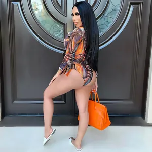 Detail of women's sexy mesh print bikini three-piece set with model posing in style