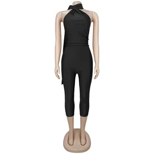 Detailed full-body view of a sexy black halter neck open back jumpsuit on a mannequin