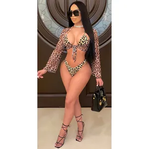 Stunning leopard print three-piece bikini set including mesh cover-up shown on a female model