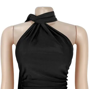 Detailed macro view of the sexy black halter neck twist on a solid color jumpsuit