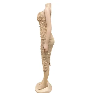 Side view of elegant champagne sequin cami maxi dress with slit detail
