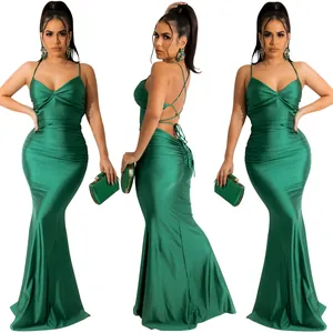 Elegant green satin mermaid evening dress featuring spaghetti straps and a backless design.