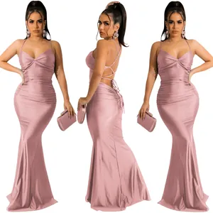 Three views of a sexy pink shimmering backless mermaid maxi dress with lace-up details