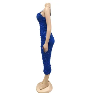 Side view of a stunning royal blue sequined spaghetti strap bodycon party midi dress