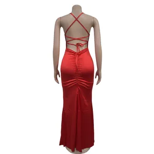 Rear view detail of a sexy red backless bodycon maxi dress with lace-up straps