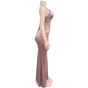 Side view detail of a pink satin backless maxi dress on a display mannequin