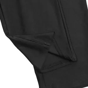 Macro view of black fabric texture and fine stitching on a solid bodycon jumpsuit