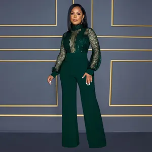 Combinaison élégante vert émeraude à paillettes avec manches longues transparentes