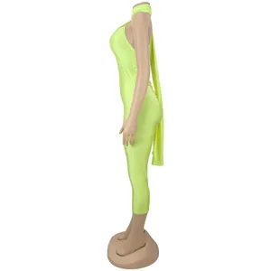 Side view of a sexy neon green backless bodysuit on a mannequin, highlighting the slim fit.