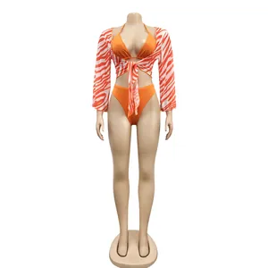 Three-piece sexy bikini set including orange swimwear and zebra print mesh cover-up detail