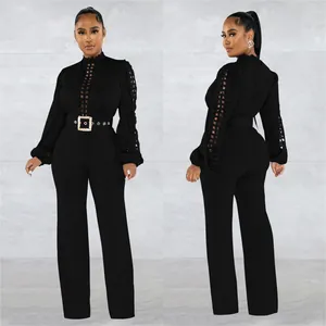 Elegant black jumpsuit with hollow-out lace sleeves and decorative square buckle belt