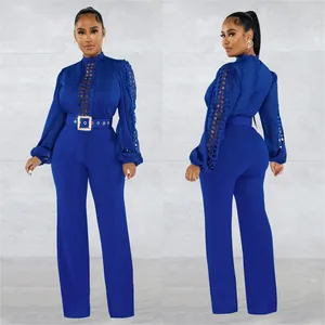 Front and back detail of royal blue long sleeve lace hollow jumpsuit with belt