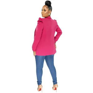 Back view detail of elegant hot pink blazer with ruched puff sleeves on fashion model