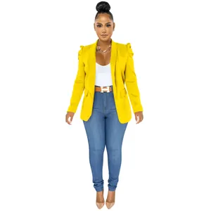 Detailed view of a chic women's yellow long sleeve blazer with ruffled shoulder accents.