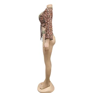 Detailed side view of sexy leopard print three-piece bikini set with mesh cover-up