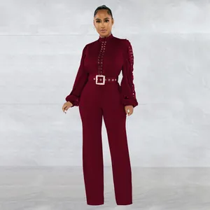 Elegant burgundy long sleeve jumpsuit with front lace-up detail and matching square buckle belt