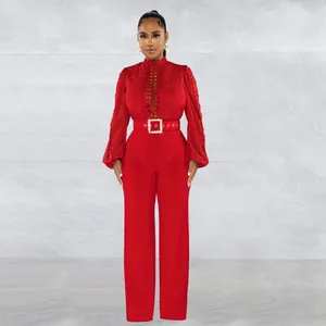 Elegant red long sleeve jumpsuit featuring lace hollow details and a matching waist belt