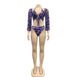 Three-piece bikini set with purple peacock feather print and long-sleeve mesh cover-up