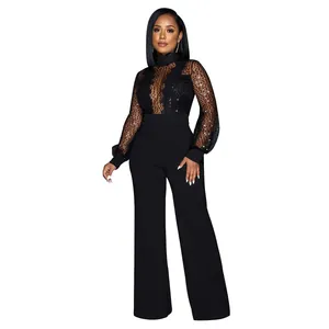 Combinaison en dentelle mesh noire avec pantalon large portée par un mannequin, vue complète.