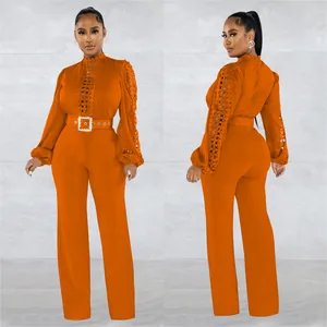 Elegant orange long sleeve jumpsuit with lace hollow-out details and belt