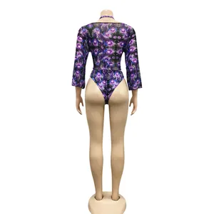 Detailed back view of a sexy purple peacock print mesh bodysuit set on a mannequin