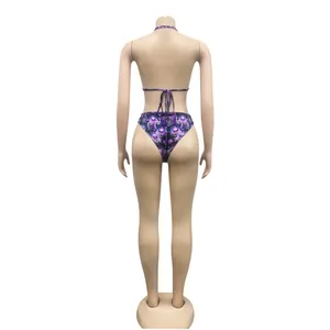 Back view of a sexy purple bikini set with peacock feather print on a mannequin