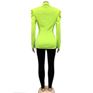 Detailed back view of a vibrant neon green long sleeve blazer with ruched puffed shoulders