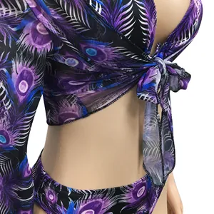Close-up detail of sexy purple peacock feather print mesh tie-front top and bikini set
