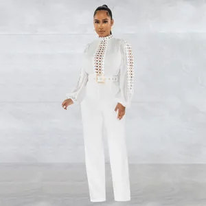 Elegant white long sleeve jumpsuit with lace hollow details and matching belt design