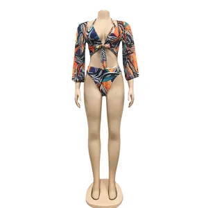 Front full view of vibrant 3-piece bikini set with matching mesh cover-up on mannequin
