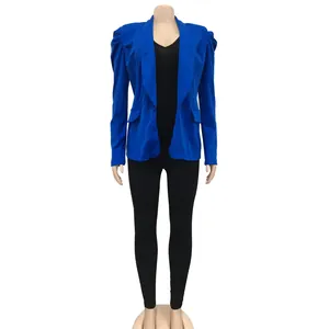 Detailed view of royal blue women's blazer featuring elegant puff sleeves and ruched shoulders