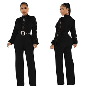 Front and back view of elegant black long sleeve lace hollow-out jumpsuit with belt.